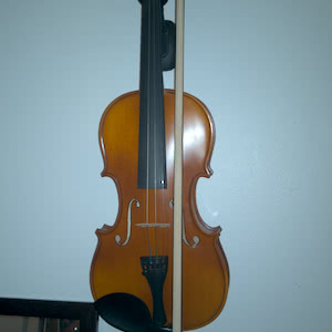 A cheap violin with a missing string.