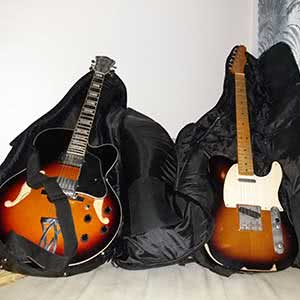 An Ibanez guitar and a Fender guitar.